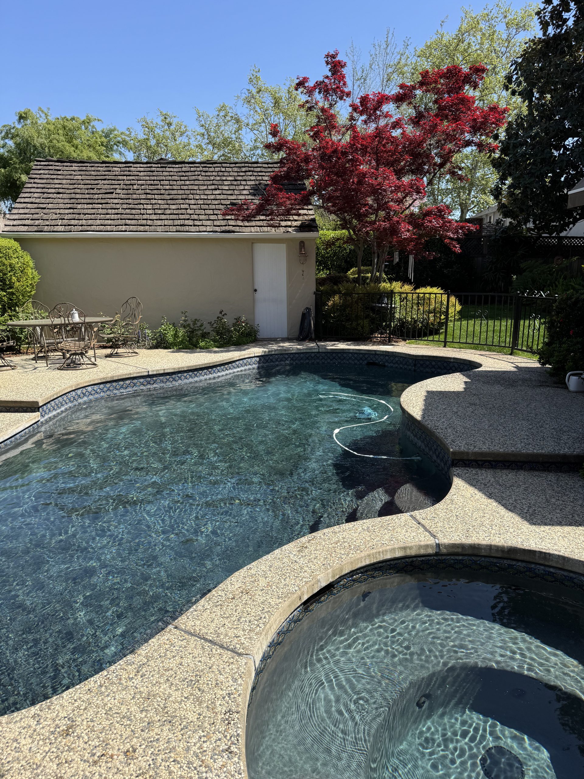 Pool service in Sacramento CA maintaining clean and balanced residential swimming pool
