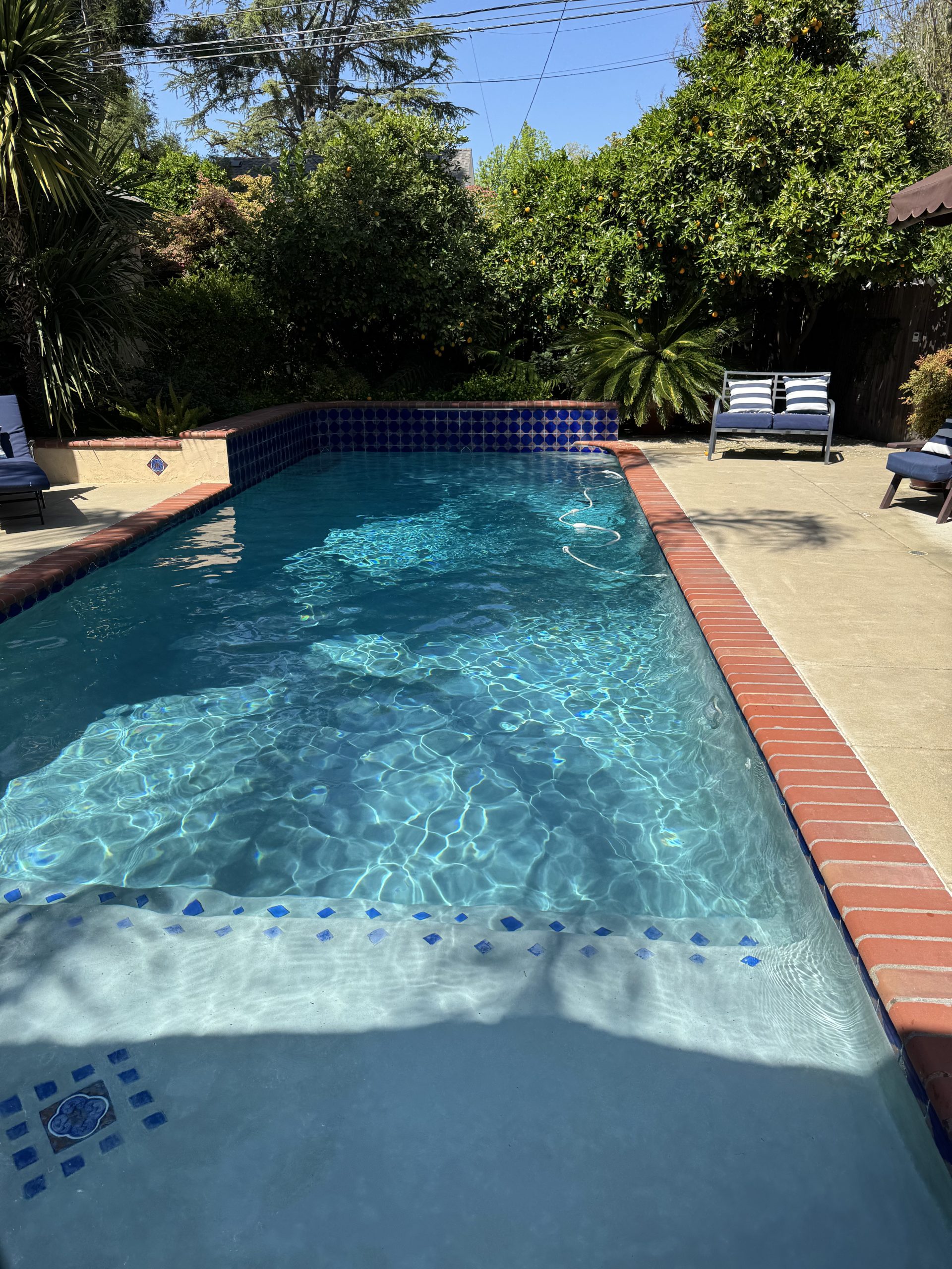 Pool service in Granite Bay CA maintaining clean and clear residential swimming pool